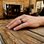 black ceramic ring band on finger