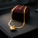 herringbone gold chain with heart pendant
