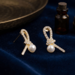 Fashion Gold Tone Ribbon Knot Pearl Stud Earrings for Women and Teen Girls, Elegant Crystal Rhinestone Bow Jewelry - Image 4